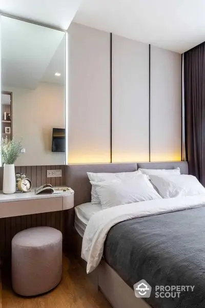 Elegant bedroom with modern design, featuring a cozy bed, ambient lighting, and sleek built-in furniture, perfect for urban living.