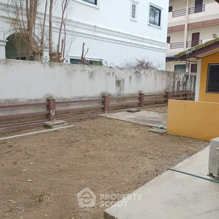 Spacious backyard area with potential for landscaping or outdoor activities.