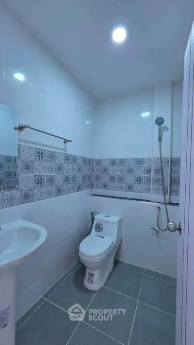 Modern bathroom with stylish tile accents and sleek fixtures in a contemporary home.