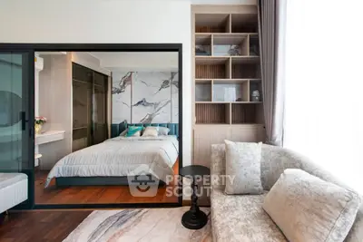 Luxurious modern bedroom with elegant decor and cozy seating area