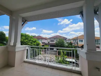 Spacious balcony with scenic neighborhood view, perfect for relaxation and enjoying the outdoors.