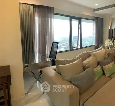 Modern living room with large windows and stylish furniture