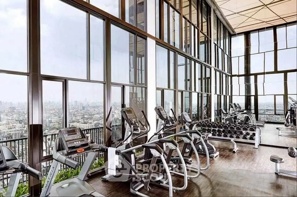 Luxurious high-rise gym with panoramic city views and modern equipment.