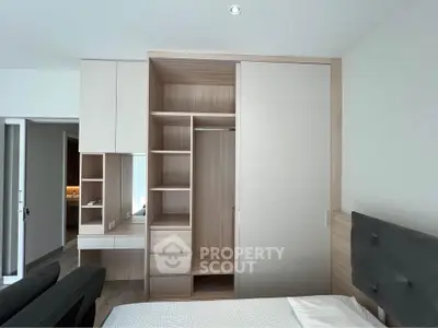 Modern bedroom with built-in wardrobe and sleek design