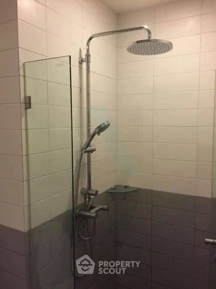 Modern bathroom with sleek shower design and glass partition