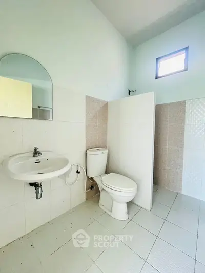 Spacious bathroom with modern fixtures and natural light