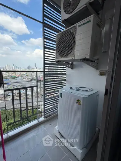 High-rise balcony with city view and air conditioning unit
