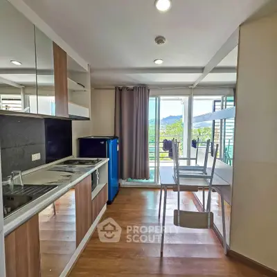 Modern kitchen with open layout and scenic balcony view