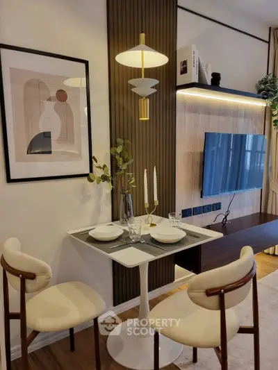 Stylish modern living room with elegant dining setup and wall-mounted TV