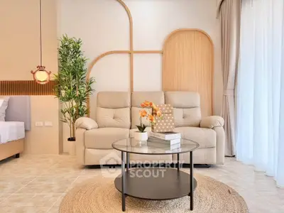 Stylish living room with modern decor and cozy seating in a bright, airy space.