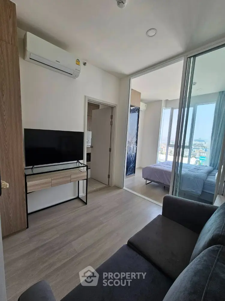 Modern apartment interior with cozy living room and bedroom view