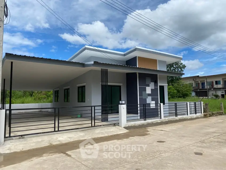 Modern single-story house with carport and sleek exterior design