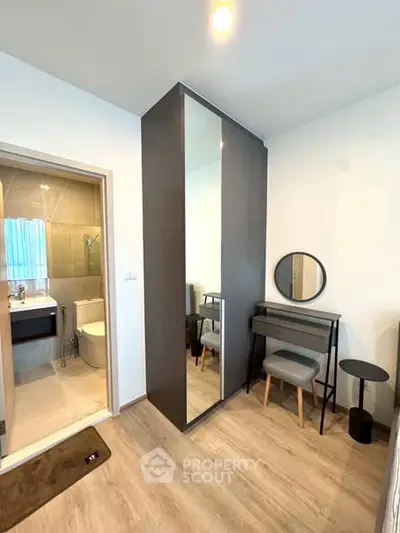 Modern bedroom with ensuite bathroom and stylish furniture