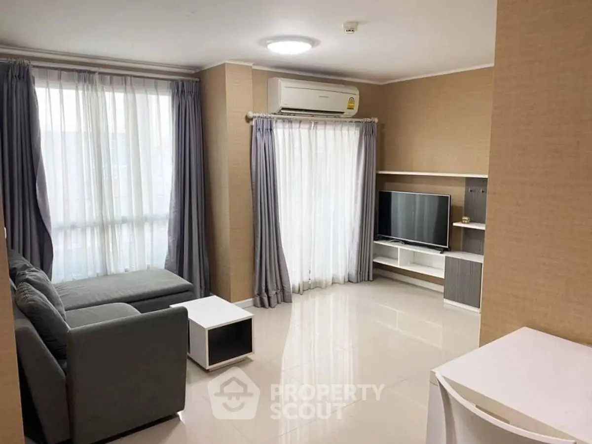 Modern living room with sleek furniture and natural light