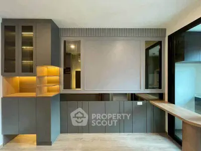 Modern interior with sleek cabinetry and built-in desk, perfect for a stylish home office or study area.