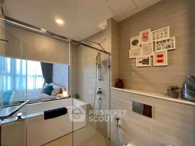 Modern bathroom with glass shower and bathtub in stylish apartment