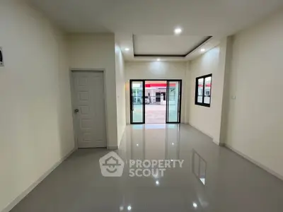 Spacious modern living room with glossy floors and large windows