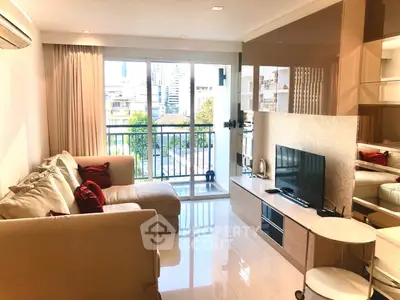Modern living room with large sofa and city view balcony