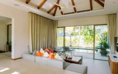 Luxurious living room with pool view and modern decor
