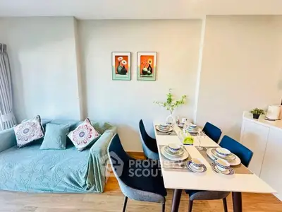 Chic dining and living area with stylish decor and cozy seating, perfect for modern living.