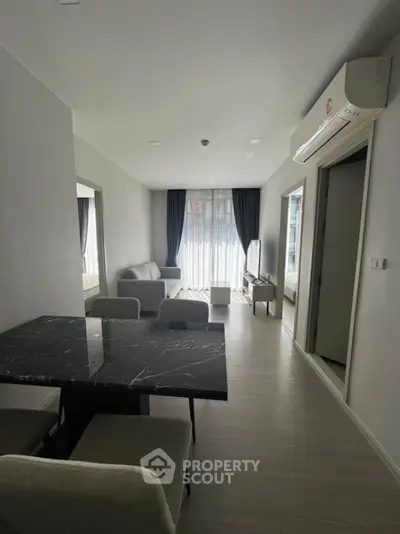 Modern living room with sleek furniture and natural light