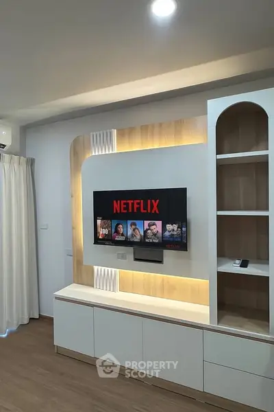 Modern living room with built-in TV unit and ambient lighting