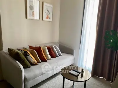 Stylish living room with modern sofa and decor, perfect for cozy relaxation.