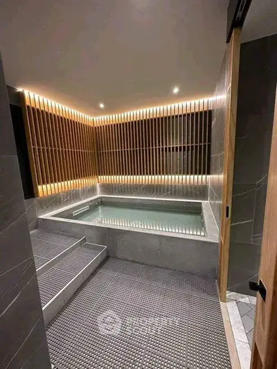 Luxurious modern bathroom with elegant lighting and spacious bathtub