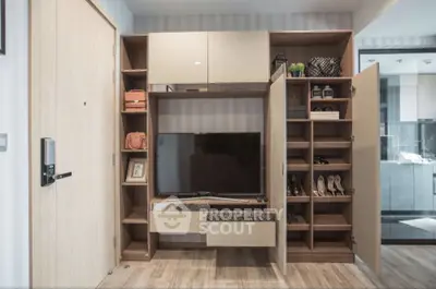 Modern living room with stylish storage and TV unit, showcasing sleek design and functionality.