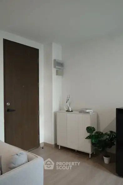 Modern living room corner with sleek furniture and minimalist decor