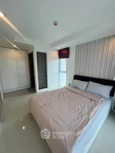 Modern bedroom with sleek design and ample natural light