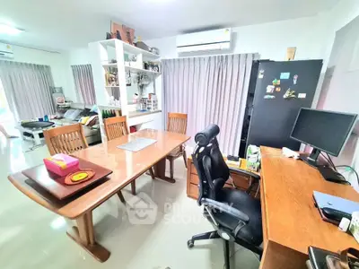 Spacious modern living room with dining area and home office setup