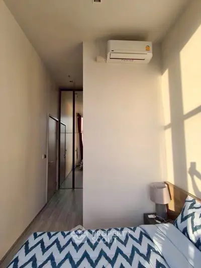 Modern bedroom with air conditioning and stylish decor in a bright apartment.
