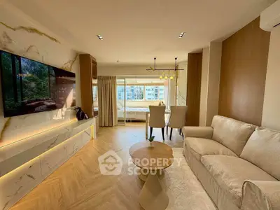 Luxurious open-plan living room with elegant decor and natural light