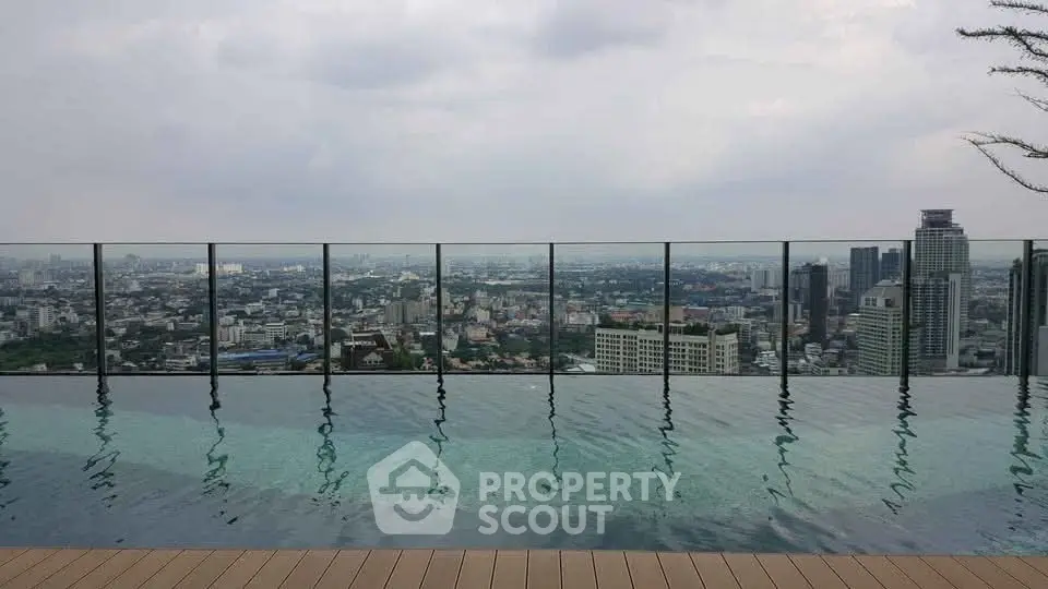Stunning rooftop infinity pool with breathtaking city skyline view
