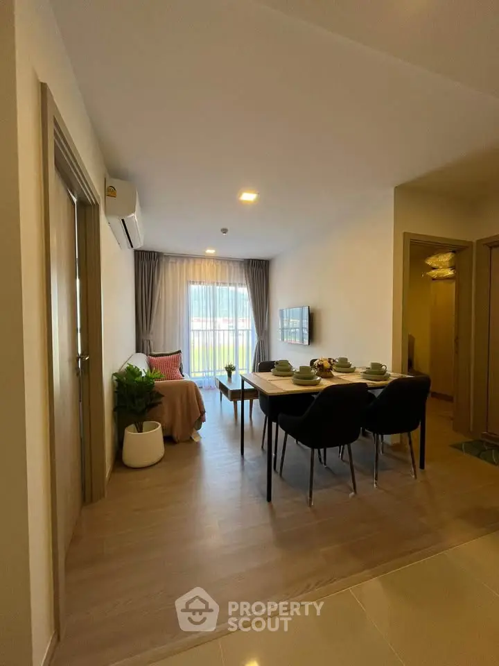 Modern dining area with elegant table setting and cozy living space