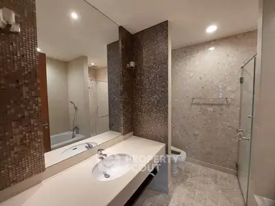Luxurious bathroom with modern fixtures and elegant tile design