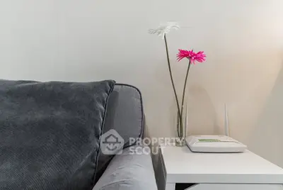 Cozy living room corner with modern sofa and minimalist decor