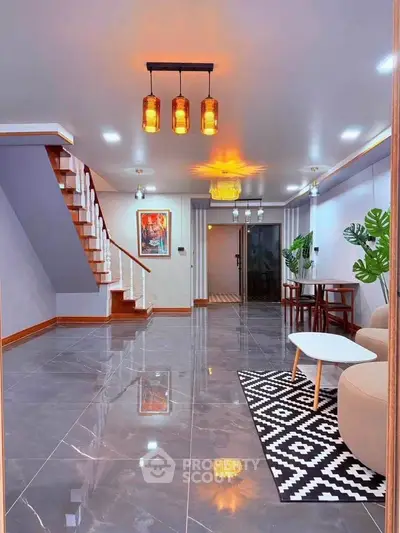 Spacious modern living room with elegant staircase and stylish decor