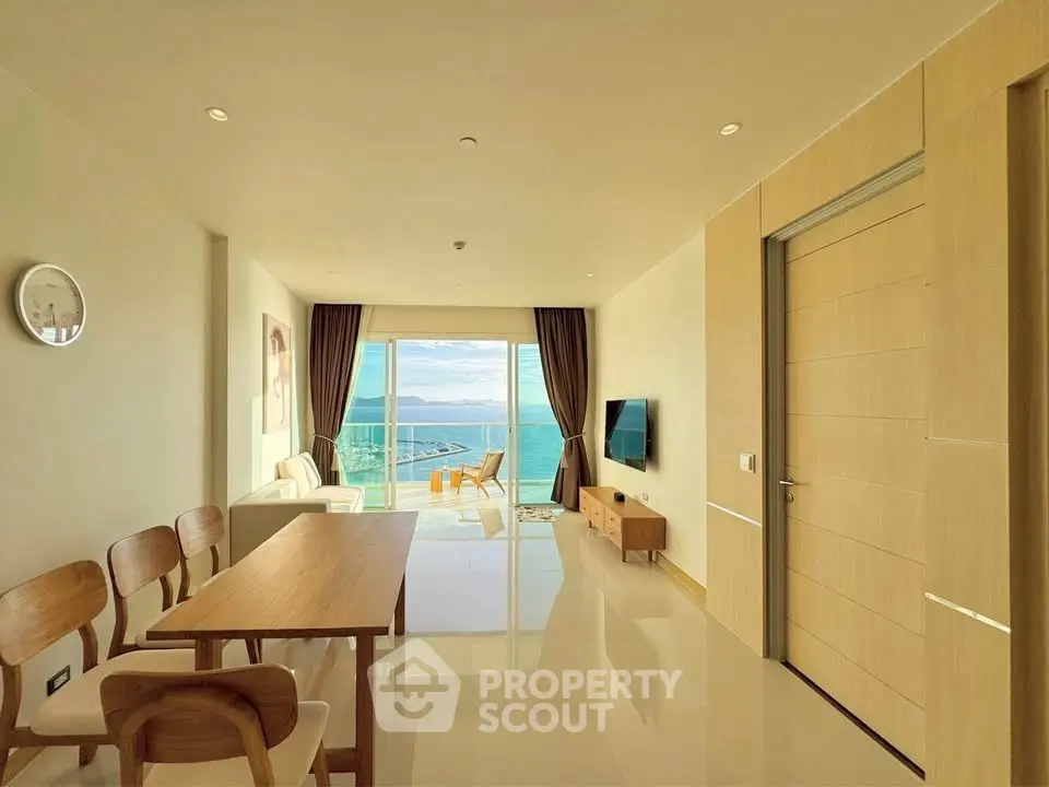 Spacious living room with ocean view and modern furnishings