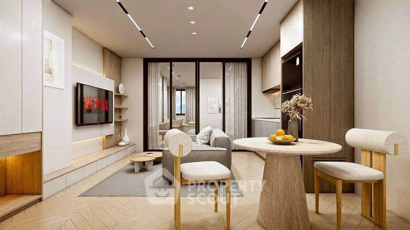 Modern living room with stylish furniture and open layout, featuring a cozy seating area and elegant decor.