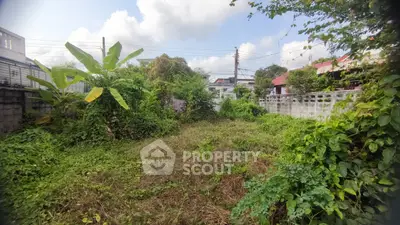 Spacious residential plot with lush greenery and potential for development