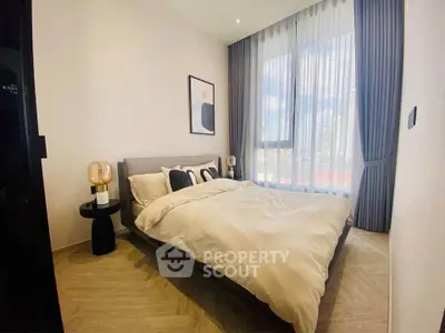 Modern bedroom with large window and stylish decor