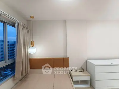 Modern bedroom with stylish pendant light and large window view