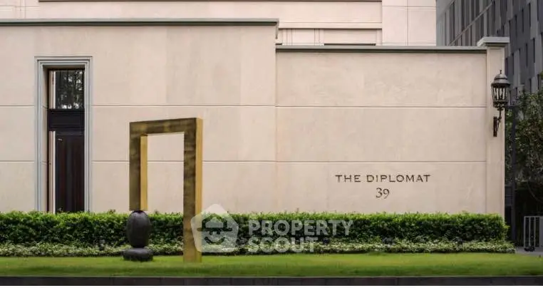 Elegant exterior of The Diplomat 39 with modern architectural design and lush greenery.