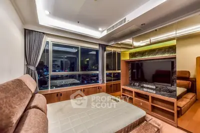 Luxurious bedroom with city view, featuring elegant furnishings and ambient lighting.