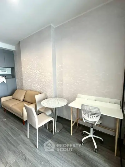 Modern living room with stylish furniture and workspace