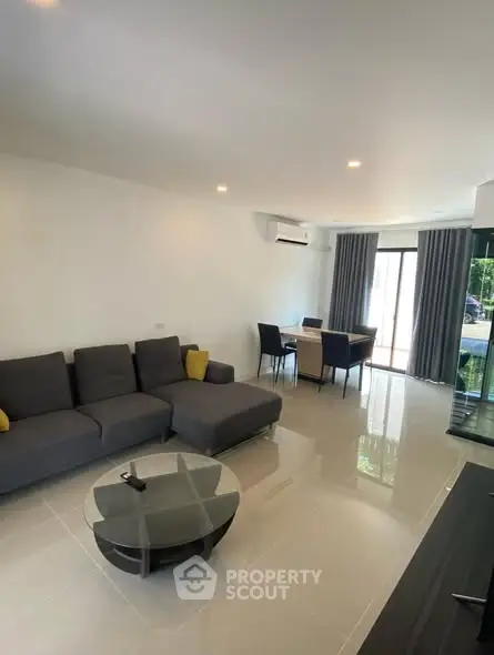 Spacious modern living room with sleek furniture and natural light