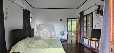 Spacious bedroom with balcony access and natural light