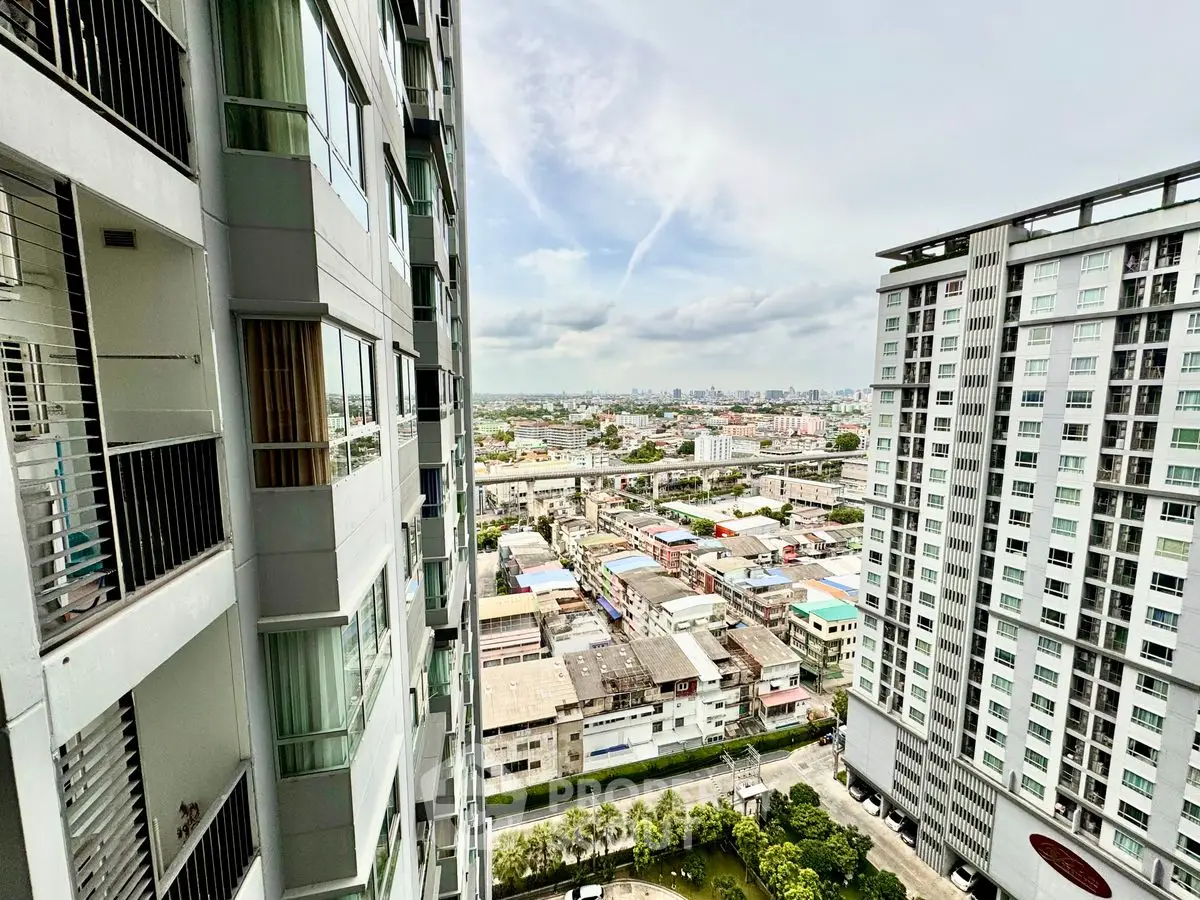 Stunning high-rise city view from modern apartment balcony